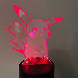 Light up Pokémon. Changes colors as shown. Comes on a stand.